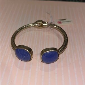 gold-tone bracelet with prominent blue chalcedony or similar blue-hued stones